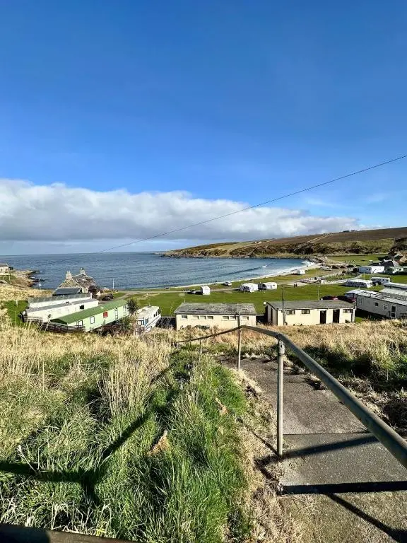 a view of a small town with the ocean at Cozy Cottage Retreat in Portsoy