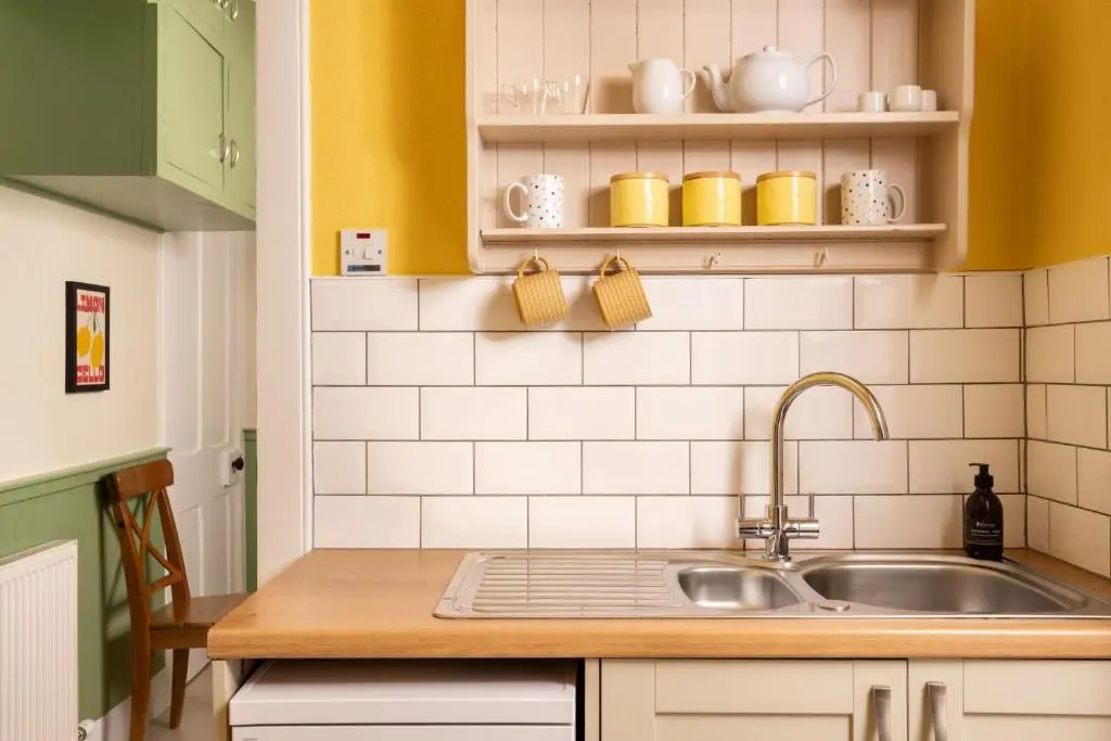 a kitchen with a sink and a counter top at Duffus House Lodge in Duffus