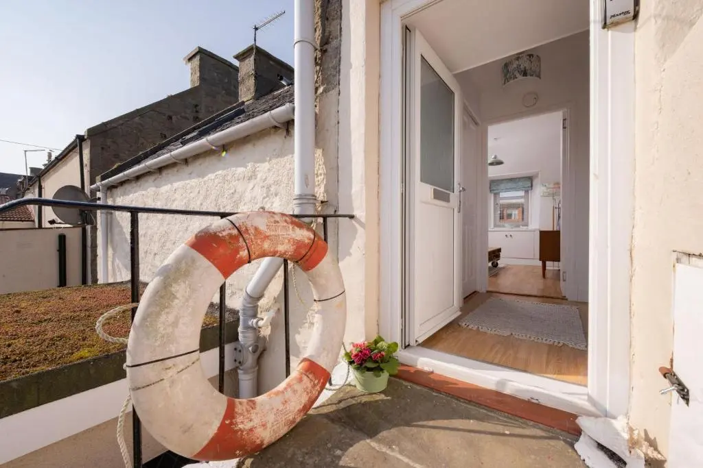 a life preserver on the side of a house at Fishermans Rest in Lossiemouth