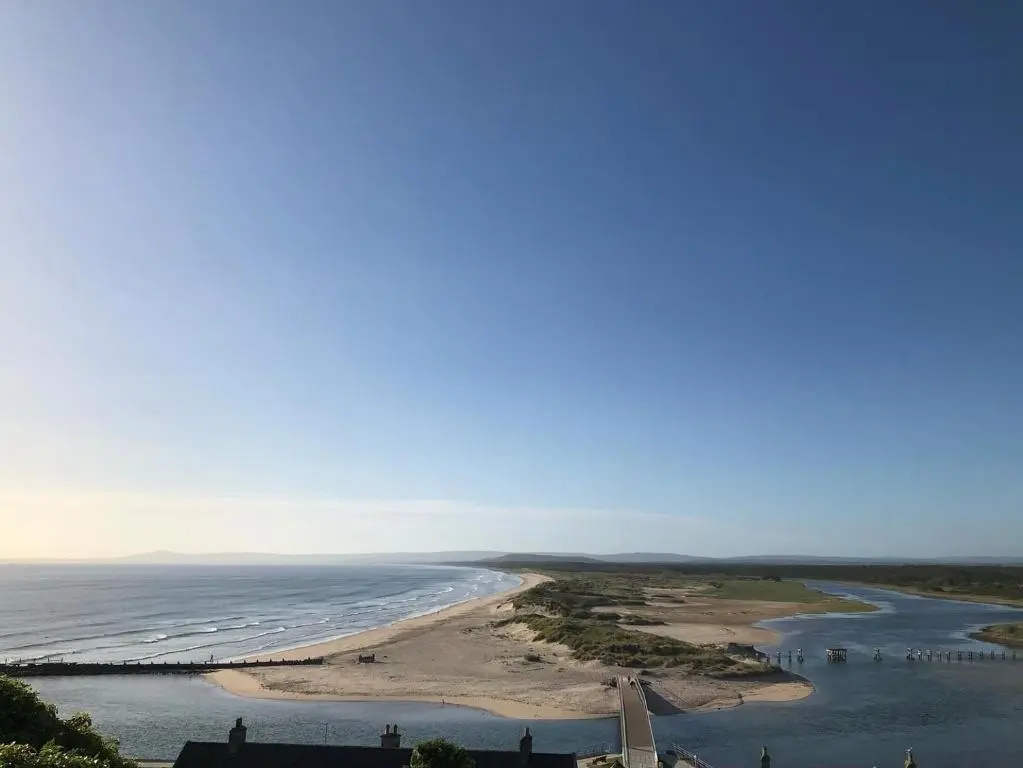 an aerial view of a beach and the ocean at Fishermans Rest in Lossiemouth