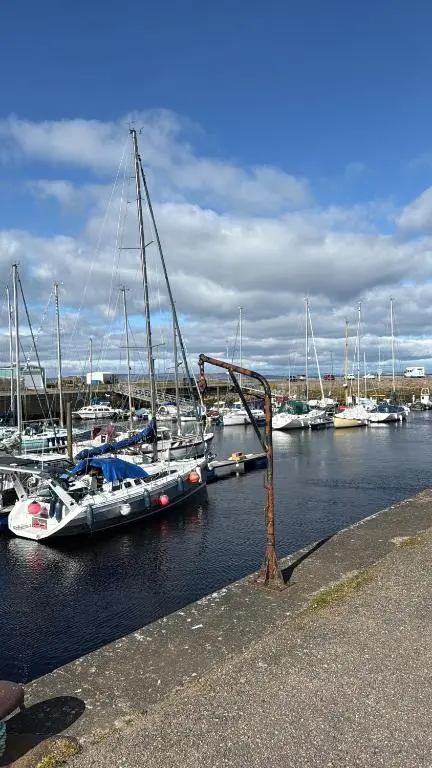 a group of boats docked in a marina at Agnes Place in Nairn