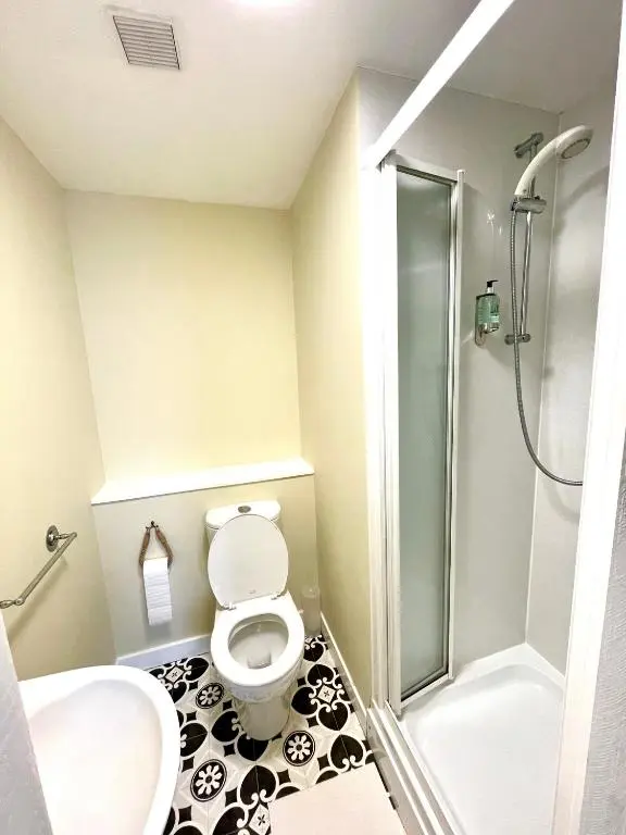 a bathroom with a toilet and a shower at Stag and Barrel in Elgin
