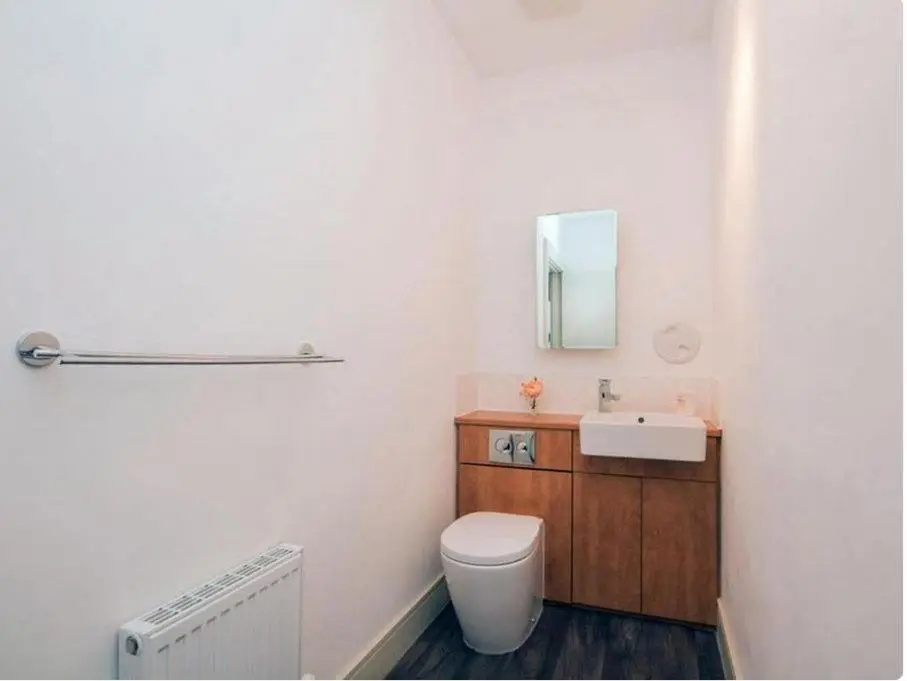 a bathroom with a toilet and a sink at Mercury Holiday Home 1 Bedroom 7 Westercraigs Apartment -Free Parking in Inverness