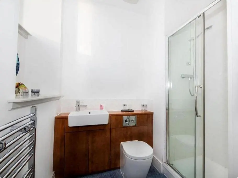a bathroom with a toilet and a sink and a shower at Mercury Holiday Home 1 Bedroom 7 Westercraigs Apartment -Free Parking in Inverness