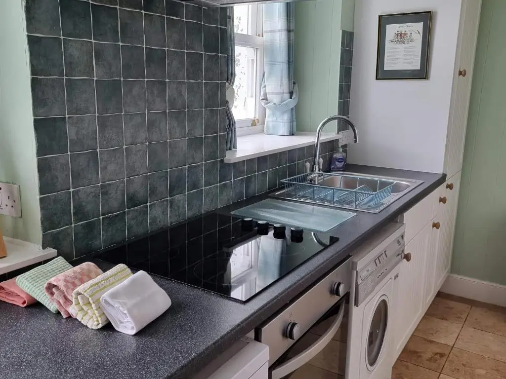 a kitchen with a sink and a counter top at Strathnoon in Inverness