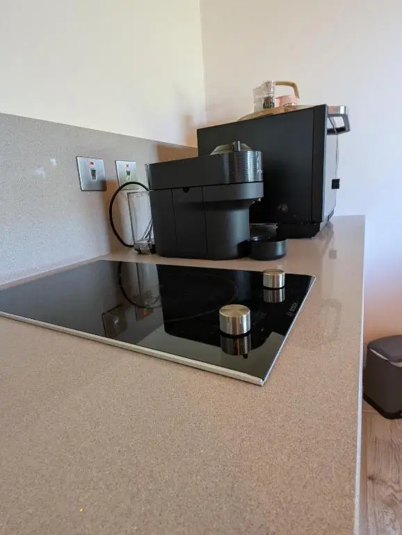 a coffee machine on a counter in a room at Modern Eco-Lodges near Findhorn Beach in Findhorn