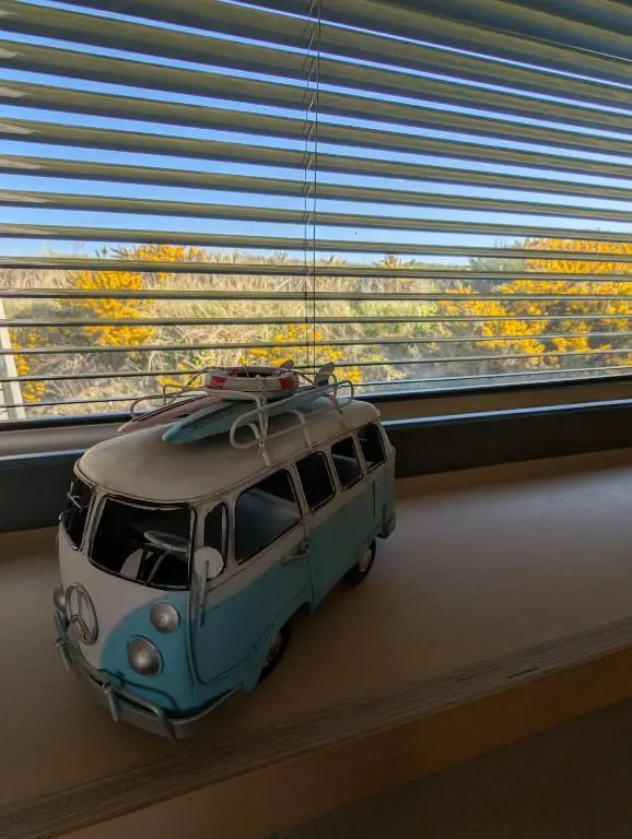a toy van with a surfboard on top of it at Modern Eco-Lodges near Findhorn Beach in Findhorn
