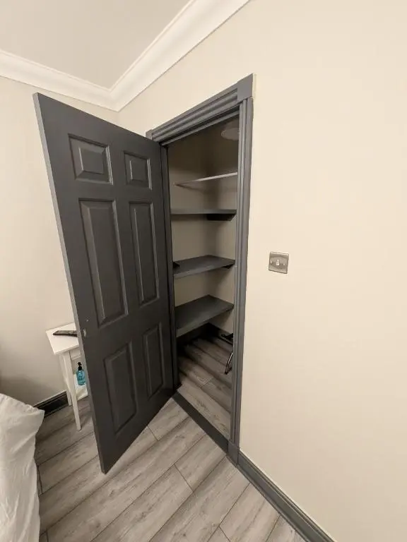 a door leading to a closet in a room at Woodgrove Holiday Homes in Inshes