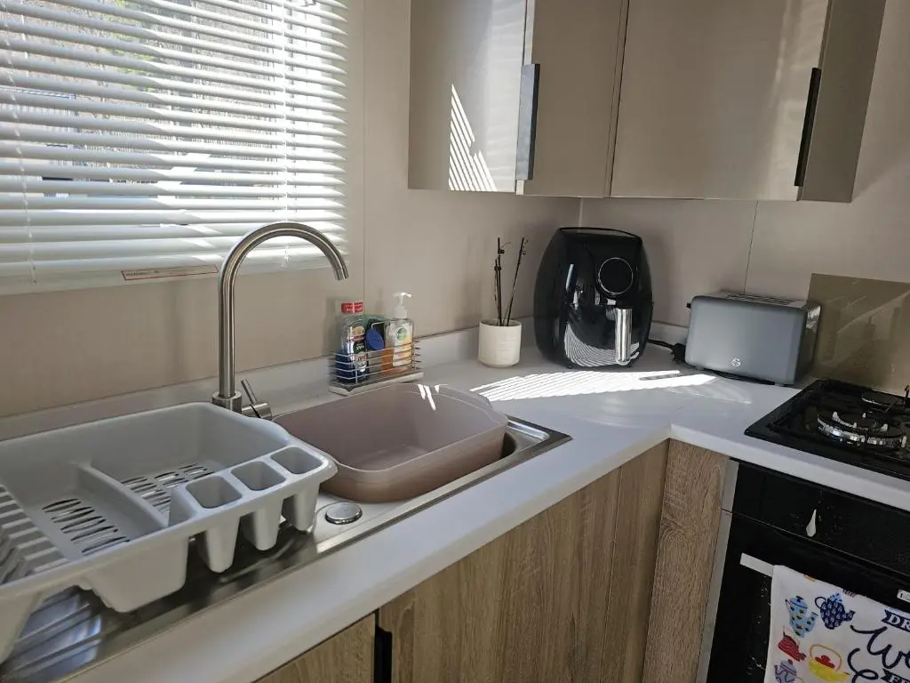 a kitchen counter top with a sink and a sink at Monash in Aviemore