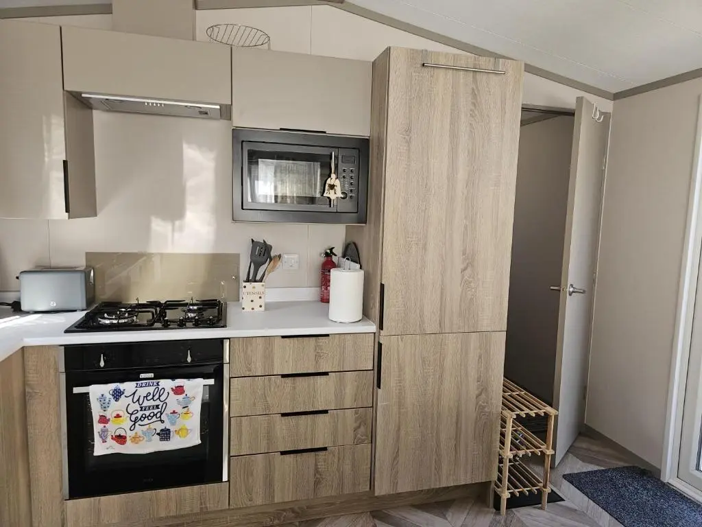 a kitchen with a stove and a counter top at Monash in Aviemore