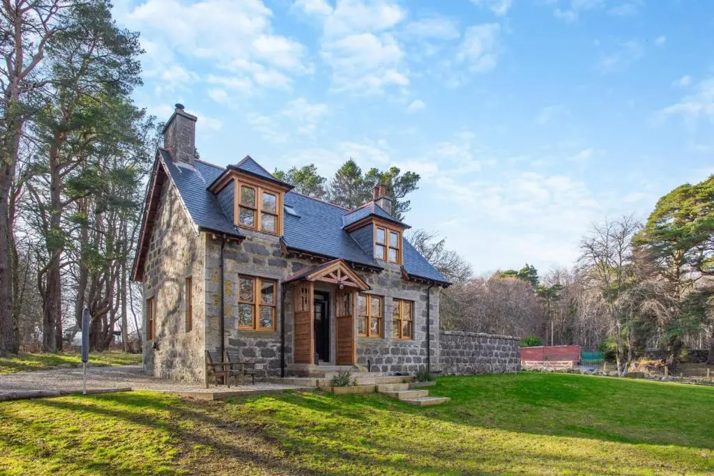 a small stone house with a blue roof at 3 Bed in Huntly oc-g31733 in Huntly