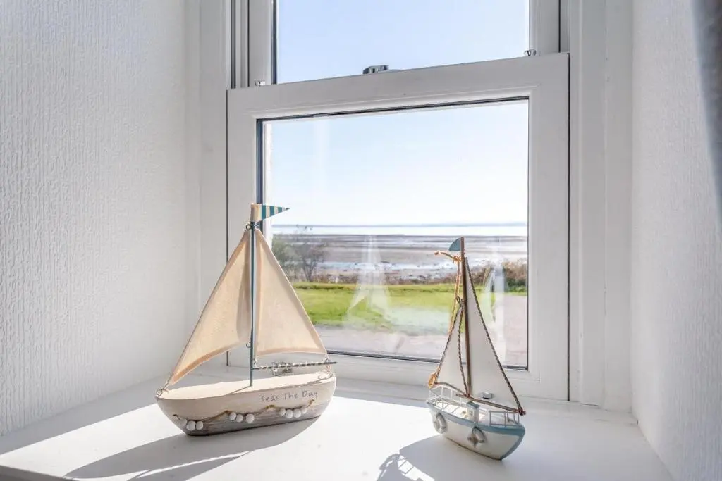 two toy boats sitting on a window sill at 3 Bed in Avoch oc-c31805 in Avoch