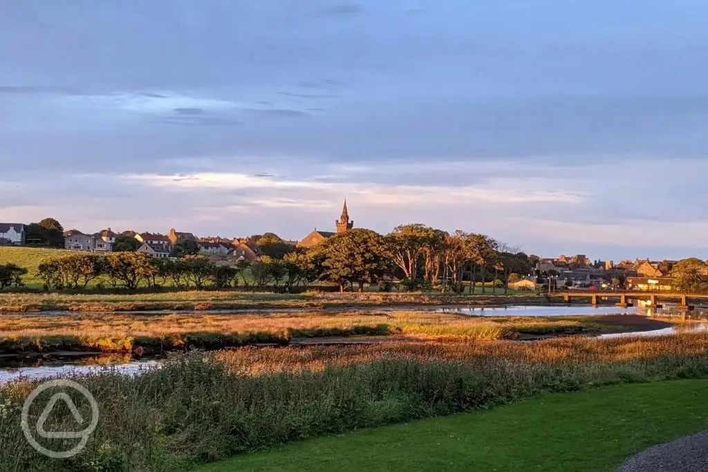 a view of a river with a town in the background at Impala Apartment in Wick