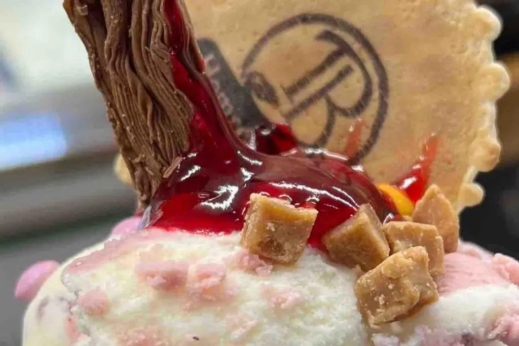 a close up of a dessert with red sauce on it at Luxury Apartment Alford Aberdeenshire in Alford