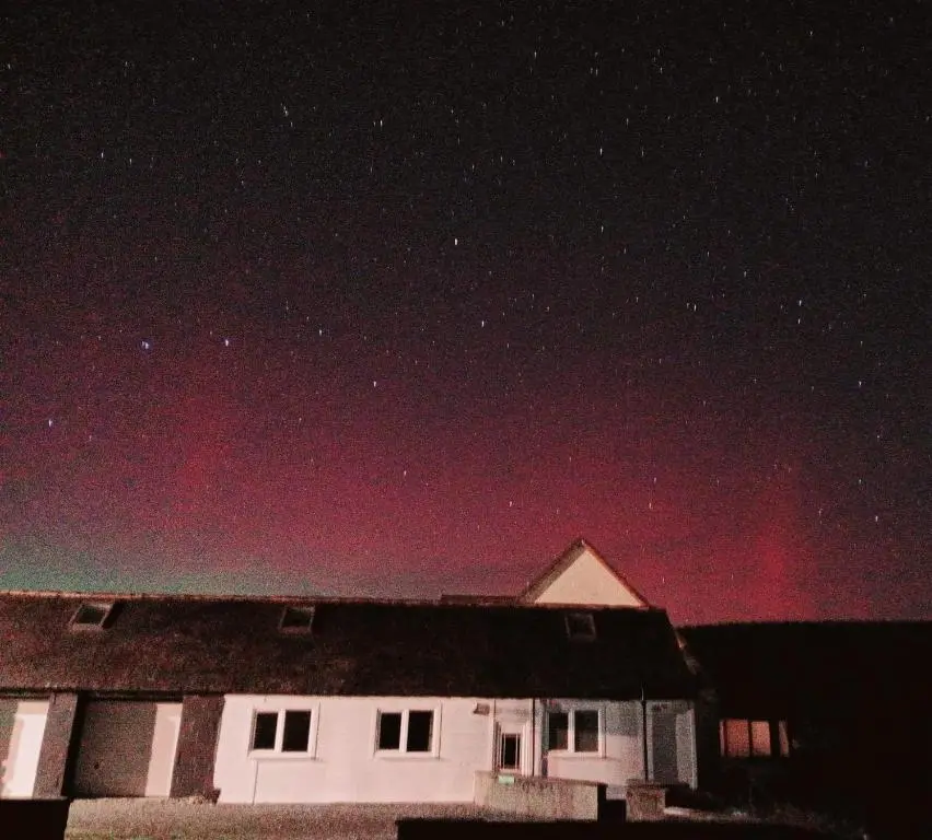 a house under a starry sky at night at Rockview Barn in Dufftown