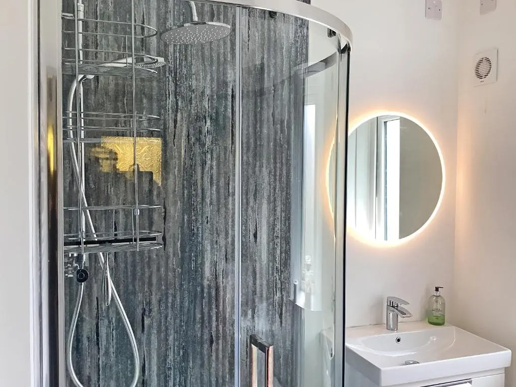 a bathroom with a shower and a sink at Seasgair in Dingwall