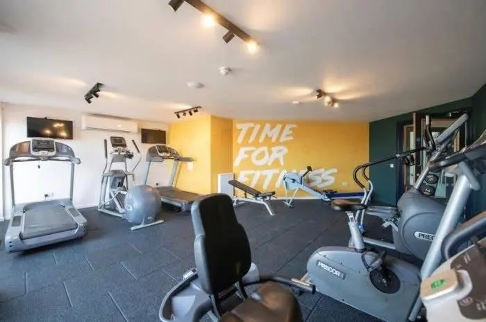 a gym with several exercise bikes in a room at 36 Lighthouse View in Lossiemouth