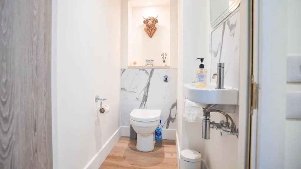 a bathroom with a toilet and a sink at St\u0101 by The Bridge, Inverness City Centre in Inverness