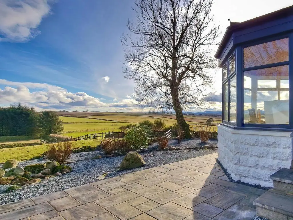 a house with a view of a field at Hogholm Farmhouse in Inverurie