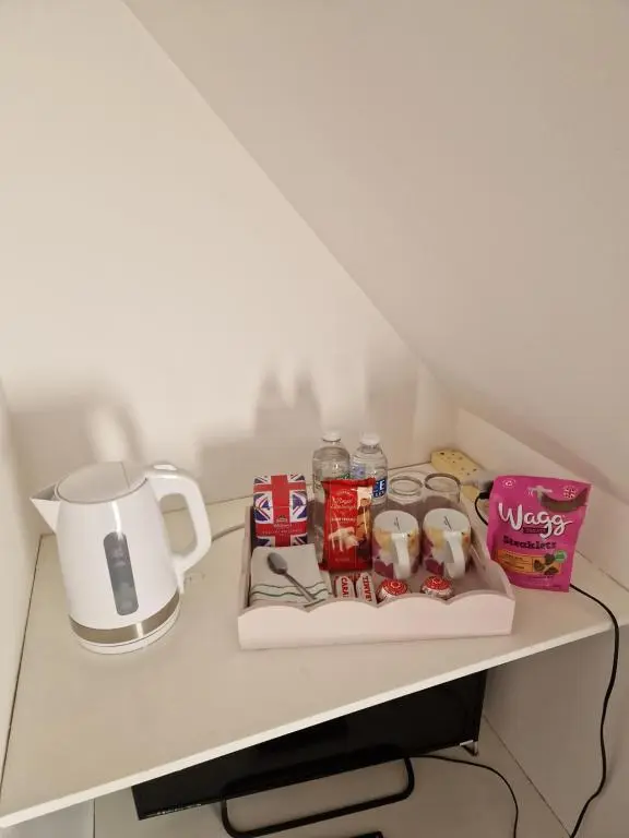 a table with a coffee pot and food on it at The harbour inn in Burghead
