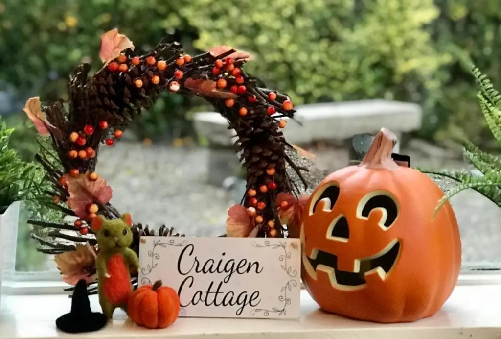 a pumpkin and a sign next to a halloween audience at Craigen Cottage Ballater in Ballater
