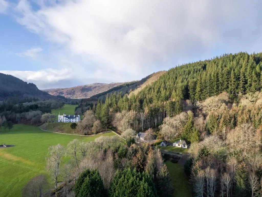 a view of a valley with a house and trees at Holiday Home Farmburn by Interhome in Invermoriston