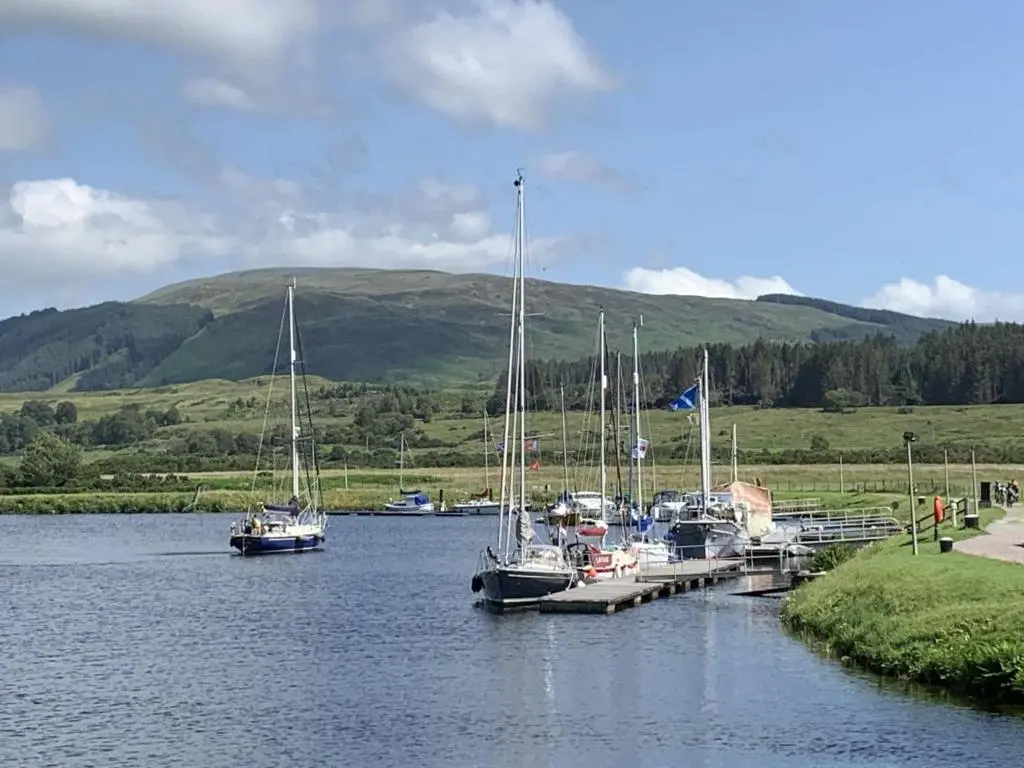 a group of boats docked at a dock in the water at Chalet Oystercatcher by Interhome in Spean Bridge