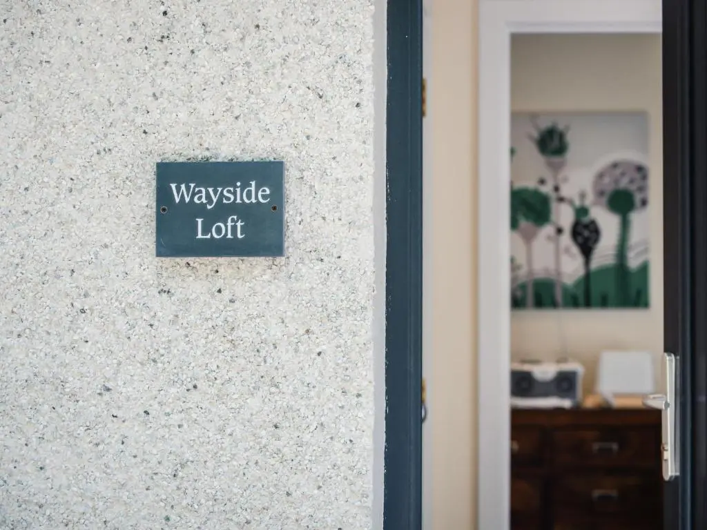 a sign on a wall that reads waveride left at Apartment Wayside Loft by Interhome in Drumnadrochit