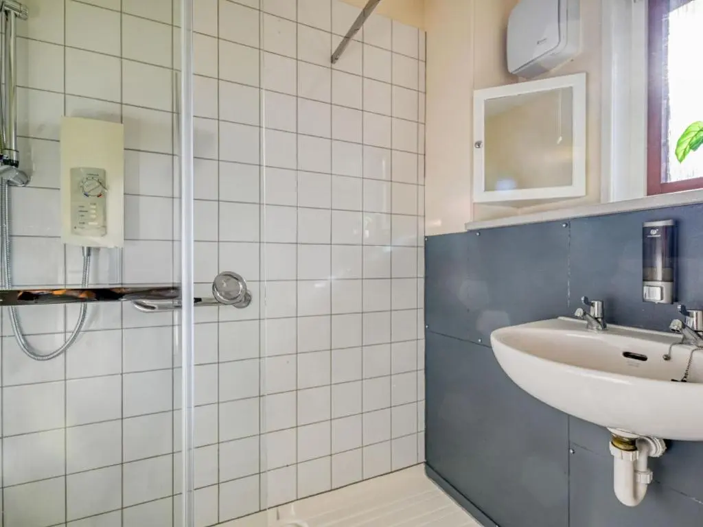 a bathroom with a sink and a shower at Holiday Home Appletree by Interhome in Muir of Ord