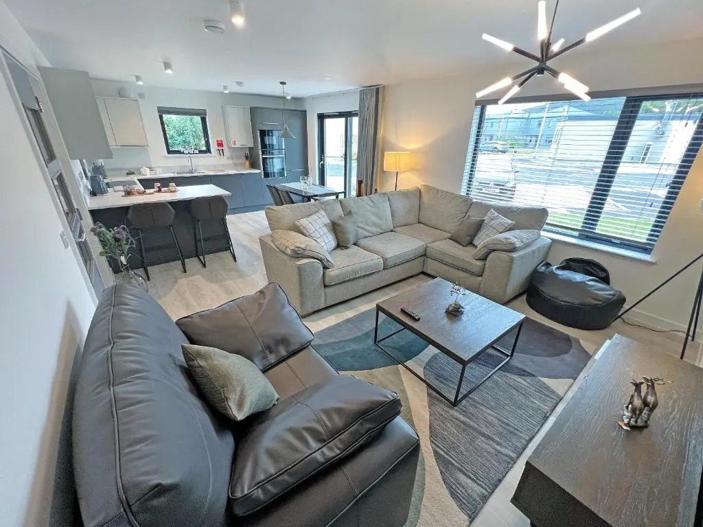a living room with a couch and a table at The Peaks in Aviemore