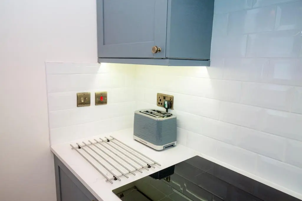 a kitchen with a counter with a toaster on it at West Lodge, High Street in Aberlour