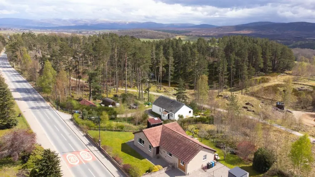 an aerial view of a house and a road at Killiechangie House in Newtonmore