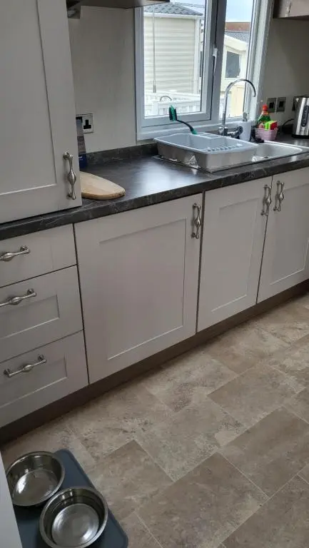a kitchen with a sink and a counter top at Northern Light Villa, forest, beach and bubbles in Burghead