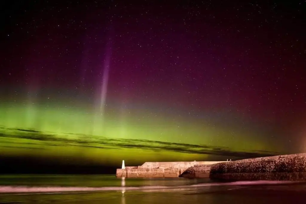 an image of the northern lights in the sky at Idyllic beach cottage 56 Seatown Cullen in Cullen