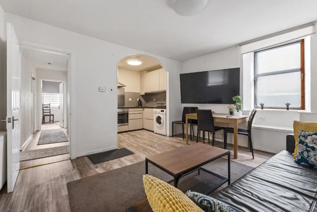 a living room with a couch and a table at BTS 2 Bed Apart Inverness Centre in Inverness