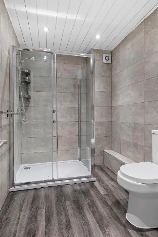 a bathroom with a shower and a toilet at BTS 2 Bed Apart Inverness Centre in Inverness