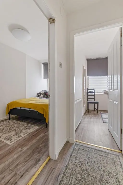 a bedroom with a bed and a sliding door at BTS 2 Bed Apart Inverness Centre in Inverness