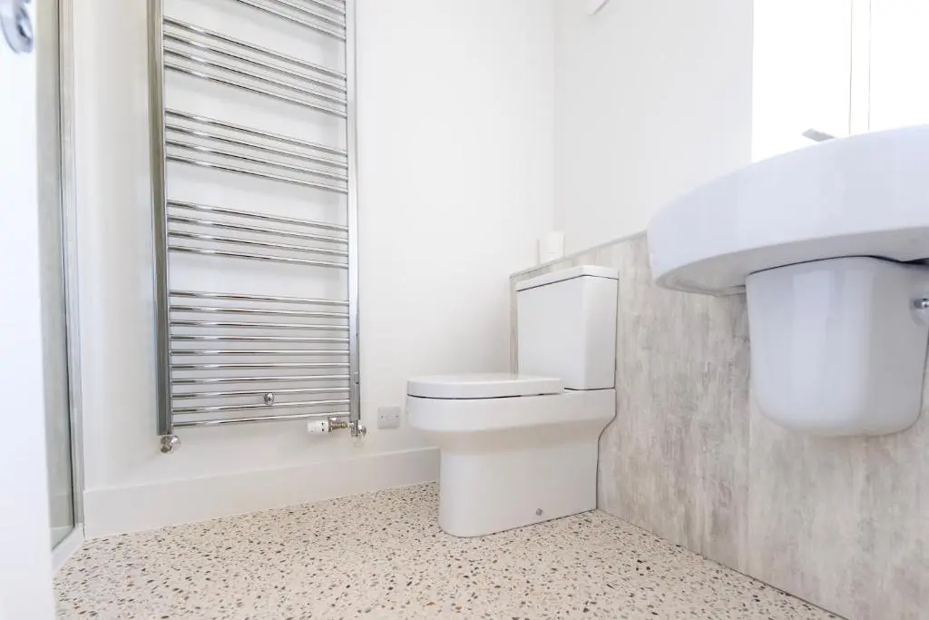 a bathroom with a toilet and a sink at Firthview Fortrose in Fortrose