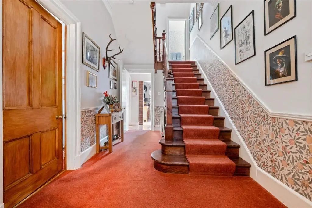 a staircase in a home with orange carpet at Gruinard Guest House in Beauly