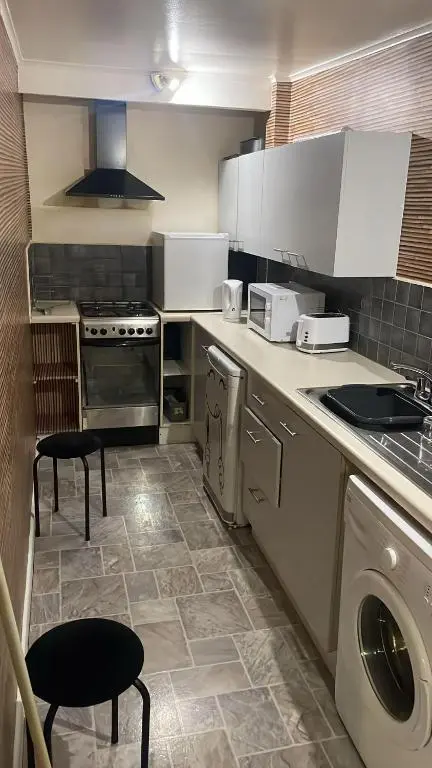 a kitchen with a stove and a dishwasher at Casale Peterculter in Peterculter