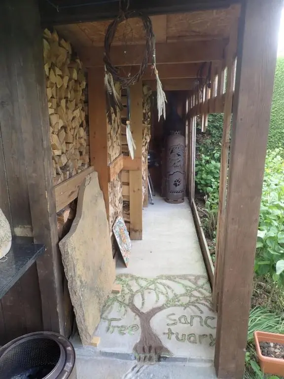 a house with a tree painted on the floor at Private Speyside Tipi Retreat and Whisky Marrying Tun Hot Tub in Coltfield