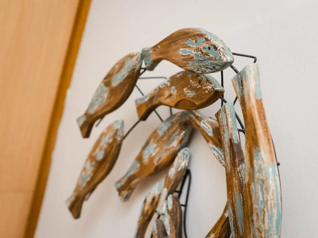 a sculpture of a praying insect on a wall at Chalet Heron Lodge by Interhome in Spean Bridge