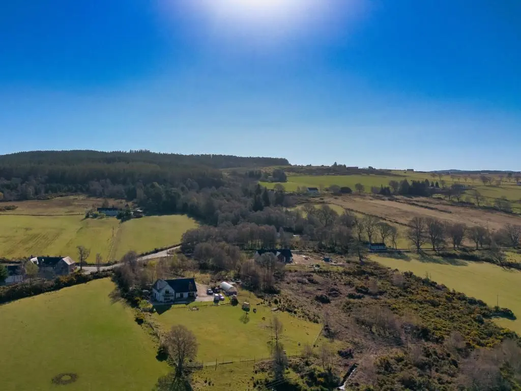 an aerial view of a farm with cows in a field at Studio Crofters View by Interhome in Inverness
