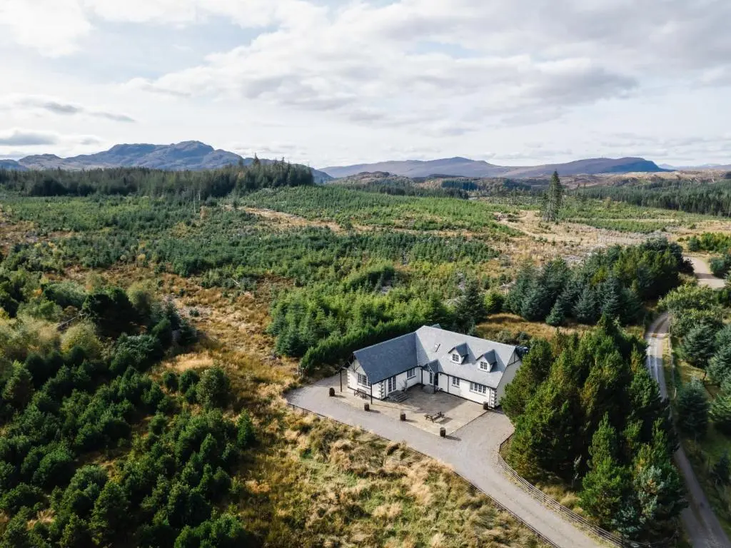 an aerial view of a house in a field at Holiday Home Mountain View Lodge by Interhome in Whitebridge