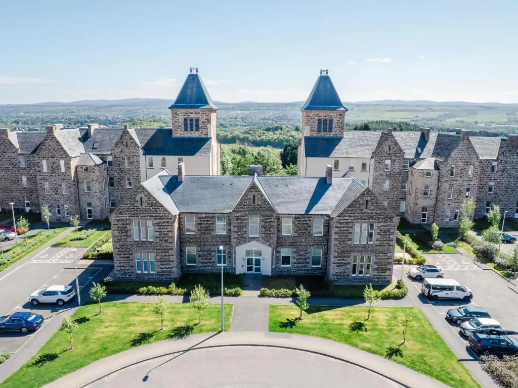 an aerial view of a large brick building with turrets at Apartment Great Glen View by Interhome in Inverness