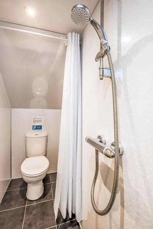 a bathroom with a shower with a toilet at Holiday Home Betty's Bothy by Interhome in Drumnadrochit