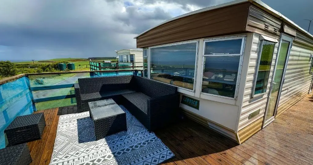 a tiny house with a pool on a deck at Caravan Nr 51 Only for Family Holiday