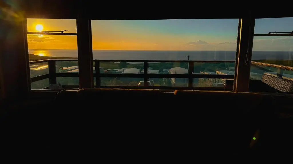 a sunset seen through a window of a cruise ship at Caravan Nr 51 Only for Family Holiday