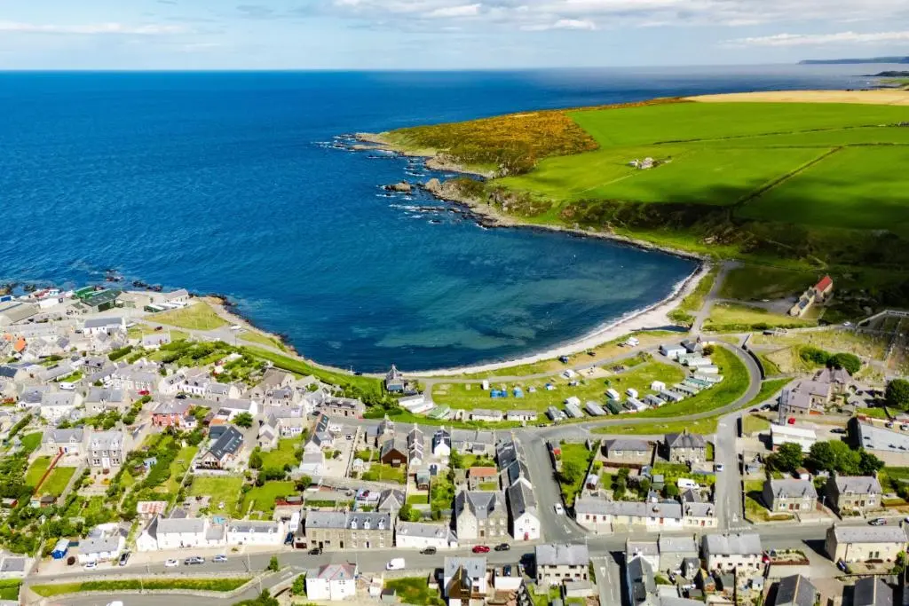 an aerial view of a town next to the ocean at Hideaway Cottage W Hot Tub in Portsoy
