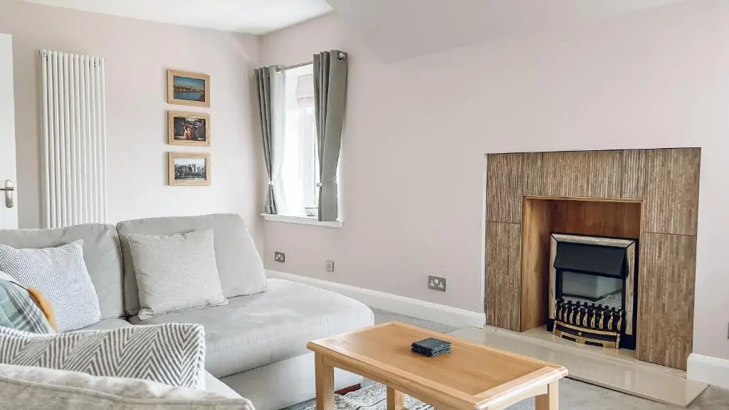 a living room with a couch and a fireplace at River-View Loft, sleeps 4, with parking in Inverness